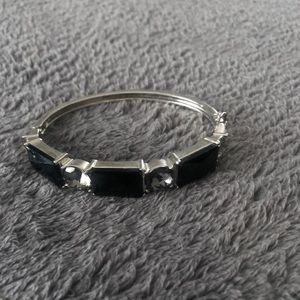 silver metal bracelet with black stones